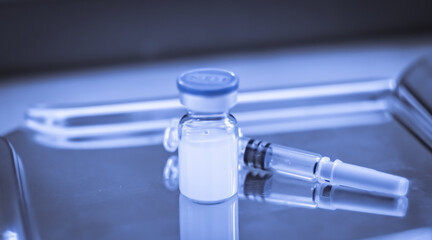 Vaccine coronavirus deverlopment vial dose flu shot drug needle syringe,medical concept vaccination hypodermic injection treatment disease care hospital prevention immunization illness disease.