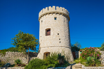 Fototapeta na wymiar Old tower fortress in town of Cres, Kvarner, Croatia