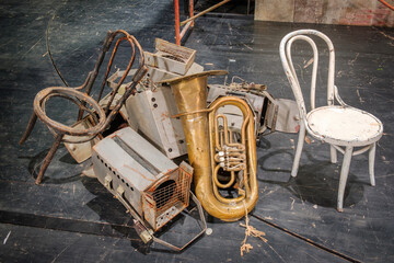Pile of the theater decoration requisites, props and equipment on the stage