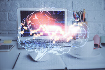 Double exposure of work space with computer and human brain drawing hologram. Brainstorm concept.
