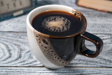 Cup of coffee on the table with beautiful foam