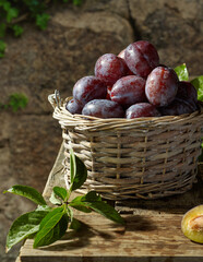 Basket with plums