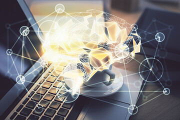 Double exposure of work space with computer and human brain drawing hologram. Brainstorm concept.