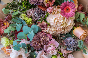 Background of bouquet of different flowers close-up, wedding and festive concept, selective focus