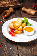 Deep fried mozzarella cheese with sauce