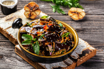 Vegetarian stew eggplants in Korean style with paprika, carrot, onion and garlic. Aubergine with vegetables. Vegan food