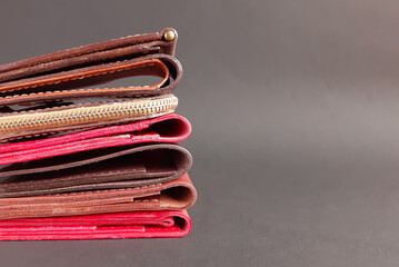 handmade leather wallets on a dark background. space for text