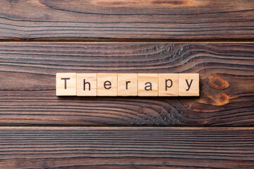 therapy word written on wood block. therapy text on cement table for your desing, concept