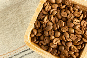 coffee beans on wooden plate