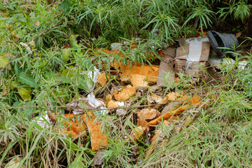 Environmental pollution. Construction debris thrown on the side of a country road.