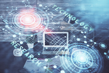 Double exposure of laptop computer and technology theme hologram. Concept of freelance work.