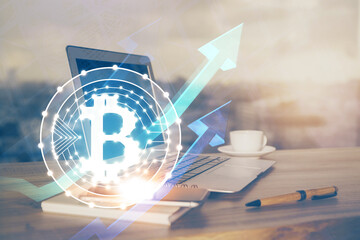 Double exposure of blockchain theme hologram and table with computer background. Concept of bitcoin...