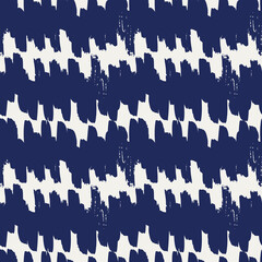Indigo brush stripes seamless vector pattern. Brush strokes forming an abstract stripe. Indigo blue hand painted repeat on white . Great for home decor, fabric, wallpaper, stationery, design projects.