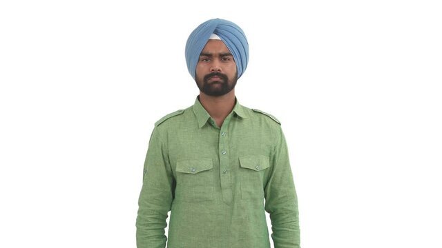 Portrait of young beard Indian man clapping hands and nodding head approvingly. Isolated on white background.