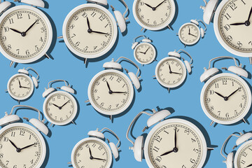 Vintage alarm clock pattern on a blue background, minimal style