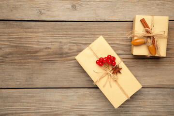 Gifts with autumn viburnum on grey wooden background. Autumn composition.