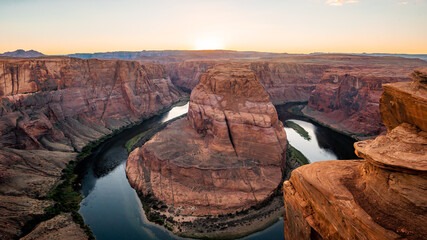 Nice View of Horseshoe bend sunset times during summer season . One of the most famous nature places in Arizona and locate near the town name Page , Arizona , United States of America