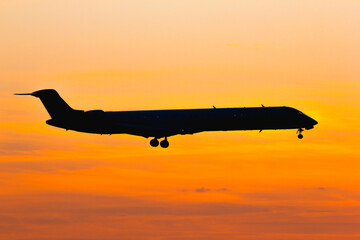 Airplane silhouette sunset