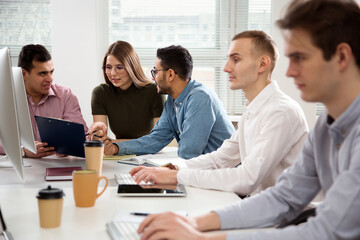 Multy-ethnic group of business people working at office