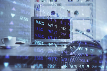 Financial market graph hologram and personal computer on background. Double exposure. Concept of forex.