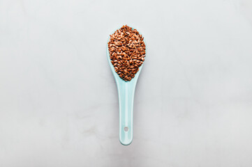 Brown Linseeds in spoon