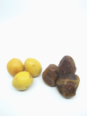 yellow and brown dates isolated on white background