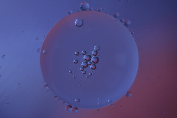 Fantastic oil drops on ble-purple background