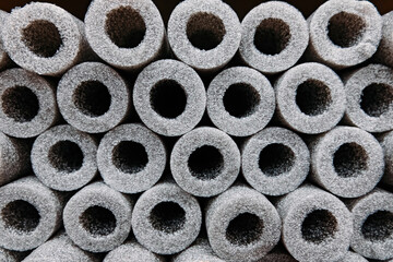 Stacked insulation for pipes of polyethylene foam in warehouse