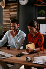 Businessman and businesswoman in office. Businesswoman and businessman working on the project