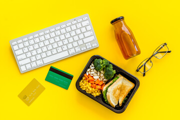 Lunch at workplace. Delivery boxes with meal, top view