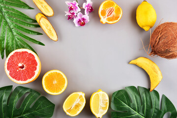 Concept on a gray background. Tropical fruits. Frame.	