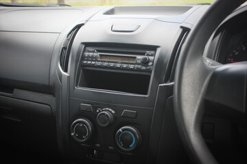 Obraz na płótnie Canvas Close up image of car dashboard audio radio air conditioner console. Car audio player.