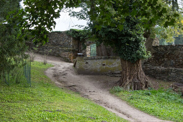Fototapeta na wymiar The path along the walls of the castle garden