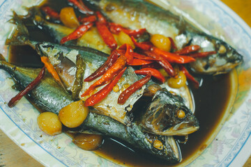 Thai mackerel in dark soy sauce with garlic and red chili pepper