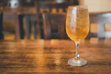 Iced tea with ice refreshing drink on wooden table