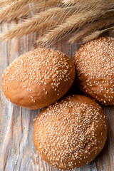 Close up of simple white buns on an old wooden table