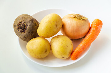 Set of vegetables in bowl for making soup or borscht. Culinary idea for dieting or fasting days