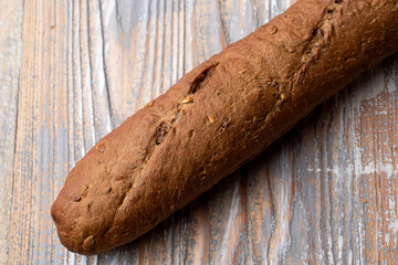 Beautiful and appetizing photo of a rye baguette for the shop