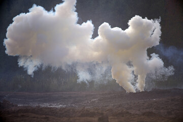 A smoke bomb on the battlefield. Smoke bombs action.