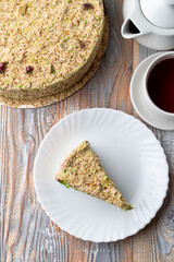 Top view of a triangle slice of cake with a whole cake aside