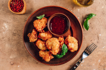 Popular Baked Cauliflower with barbeque sauce. Buffalo barbecue Cauliflower Wings. Vegan Food concept.
