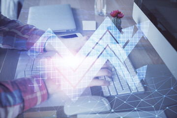 Growing arrows with businessman working on computer on background. Success concept. Double exposure.