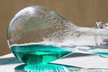 Laboratory glassware with green color reagents