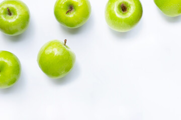 Green apples on white background. Copy space