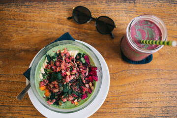 Bowl of healthy salad with tasty smoothie