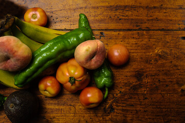 Fruit and vegetables, on wooden table.