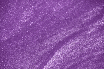 Fototapeta na wymiar de-focused. Abstract elegant, detailed purple glitter particles flow underwater. Holiday magic shimmering luxury background. Festive sparkles and lights.