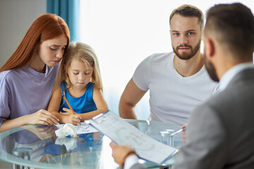 Fototapeta premium caucasian family couple turned to a lawyer to sign a divorce agreement, man and woman always quarrel and argue with each other. confident male lawyer prepares the documents