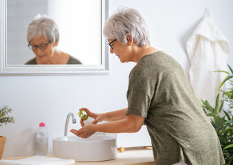 Person is washing hands with soap.