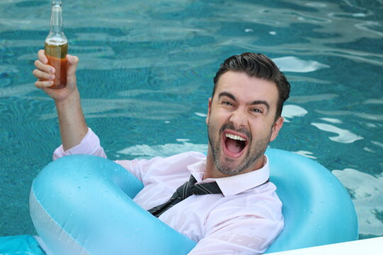 Drunk businessman jumping with clothing into swimming pool  